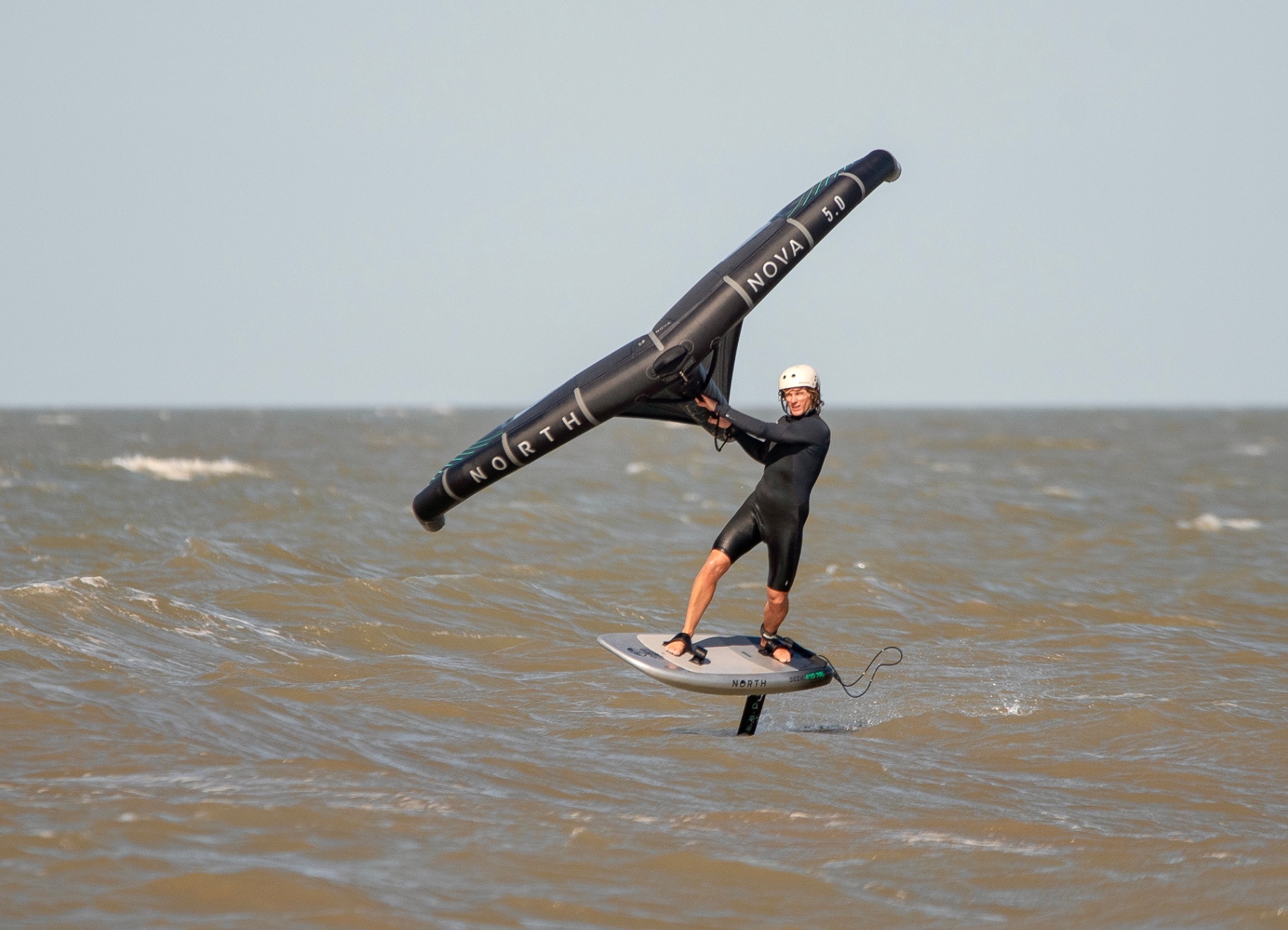 Paddleboarding on calm water along the Essex coast